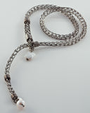 Løkkesmykke - strikket sølv med perle